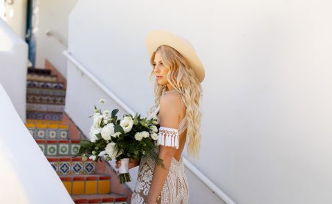 Bride holding a floral bouquet at La Quinta Resort & Club, perfect for destination weddings.
