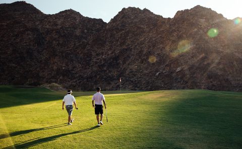Golfers enjoying a sunny day on the lush fairway at La Quinta Resort & Club.