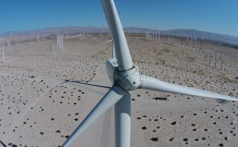 Wind turbine in desert landscape near La Quinta Resort & Club, a scenic Palm Springs destination.