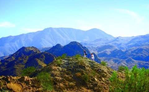 Scenic mountain landscape with hikers exploring rugged terrain at La Quinta Resort & Club.