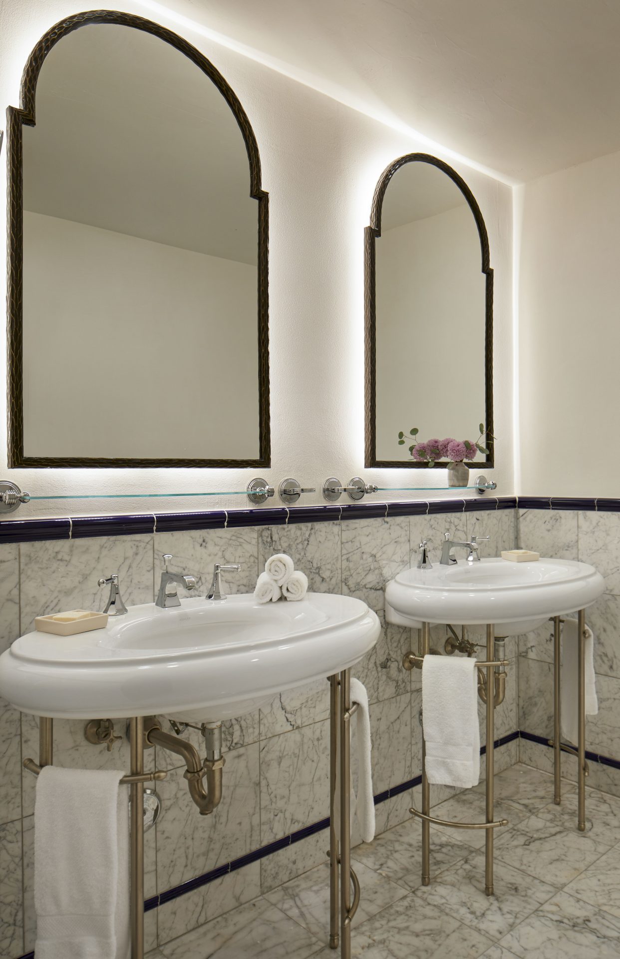 Elegant bathroom with dual sinks and mirrors in the Two-Bedroom Arzner Suite at La Quinta Resort.