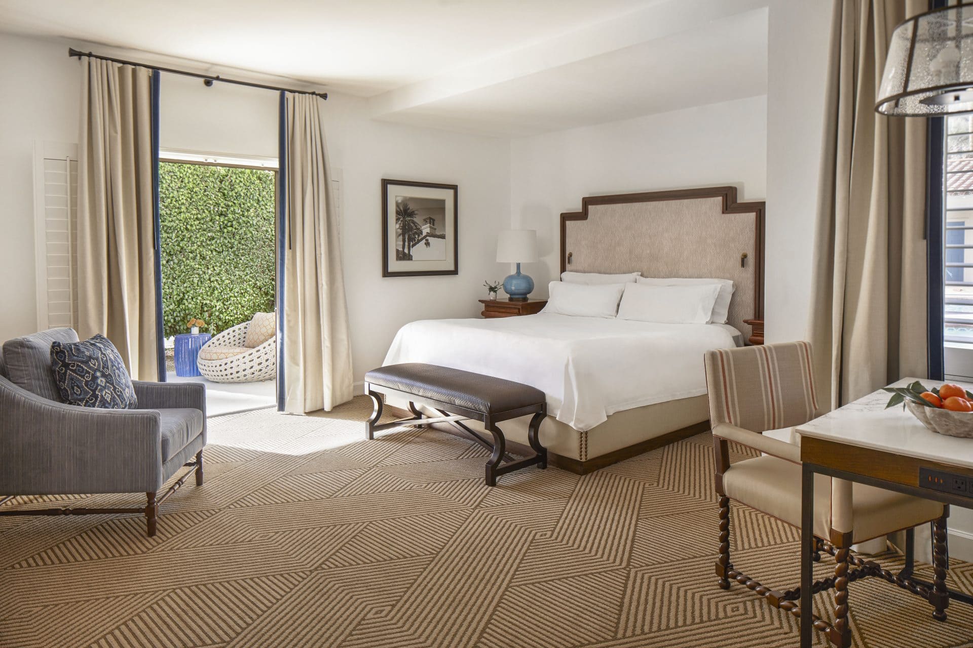Bedroom suite with luxurious furnishings and private balcony at La Quinta Resort & Club.