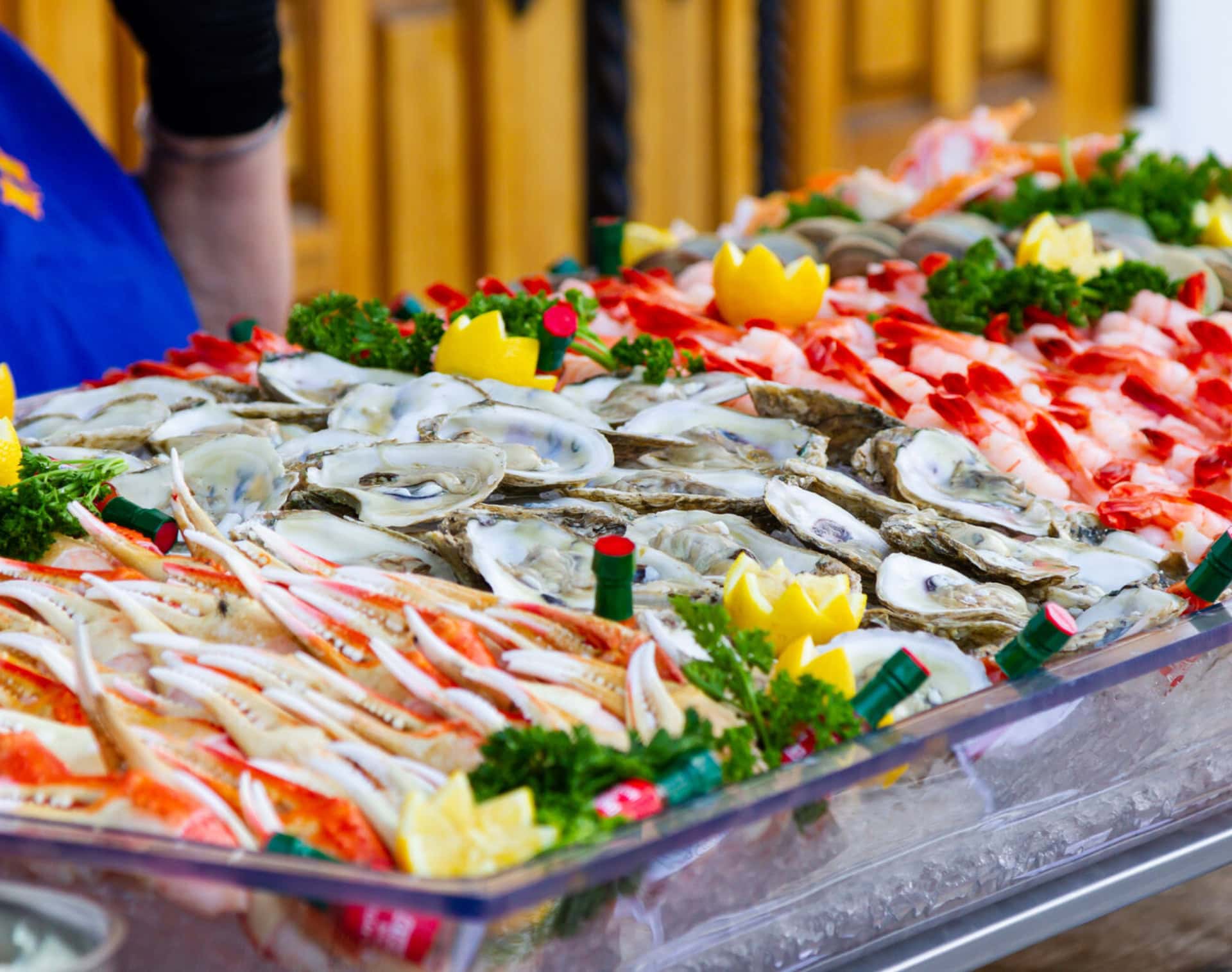 Seafood platter with oysters, crab legs, and lemon slices at La Quinta Resort & Club.