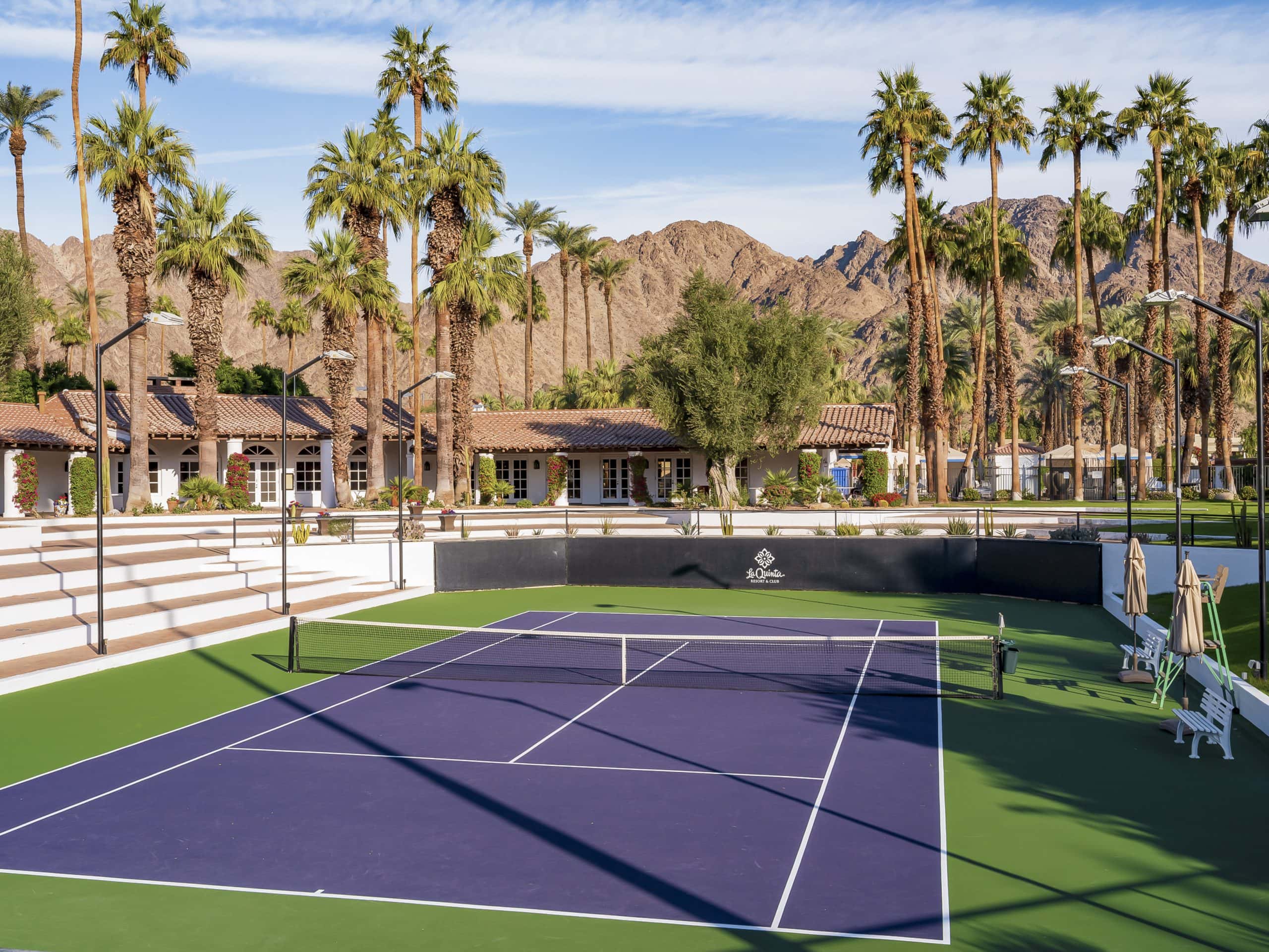 Tennis and pickleball courts surrounded by palm trees at La Quinta Resort & Club.