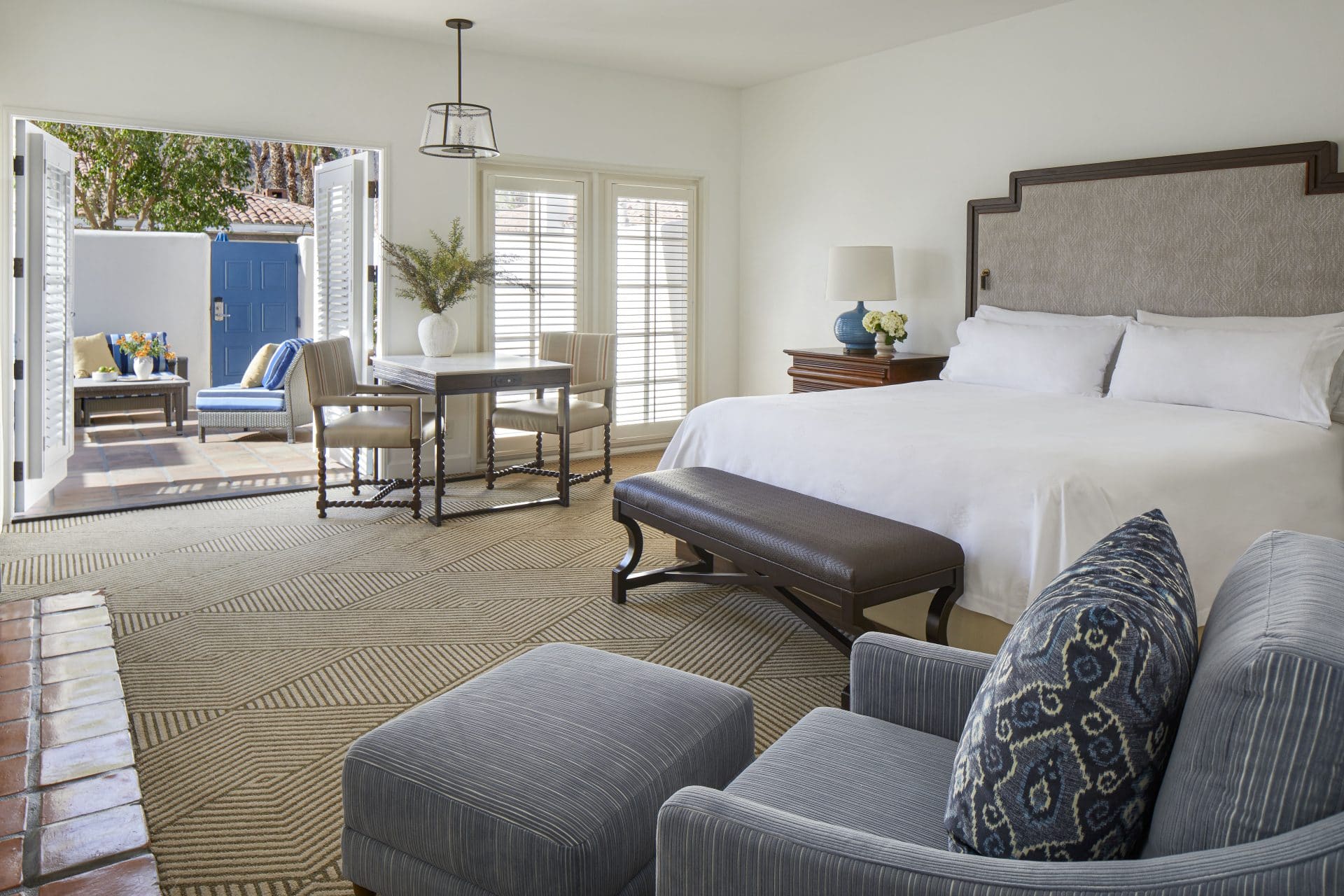 King Deluxe Casita with private patio, elegant bedroom, and outdoor seating at La Quinta Resort & Cl.