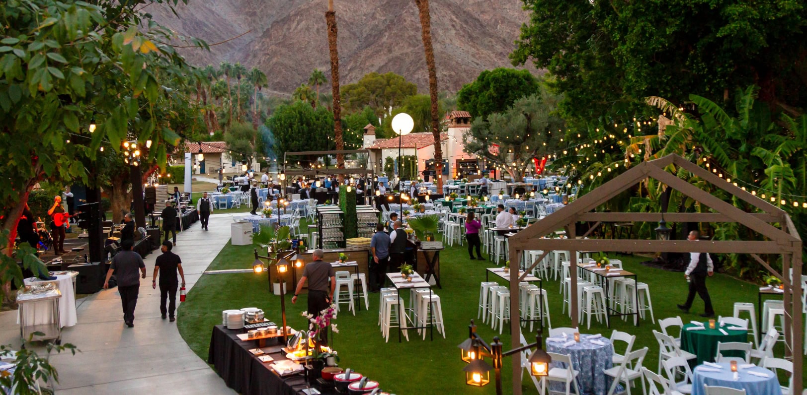 Elegant outdoor meeting setup at La Quinta Resort & Club with lush greenery and mountain views.
