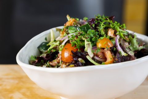 Fresh garden salad with mixed greens, cherry tomatoes, cucumbers, and herbs at La Quinta Resort & Cl.