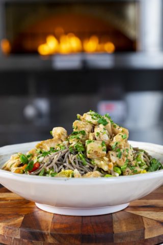 Delicious Asian noodle salad with chicken and vegetables.