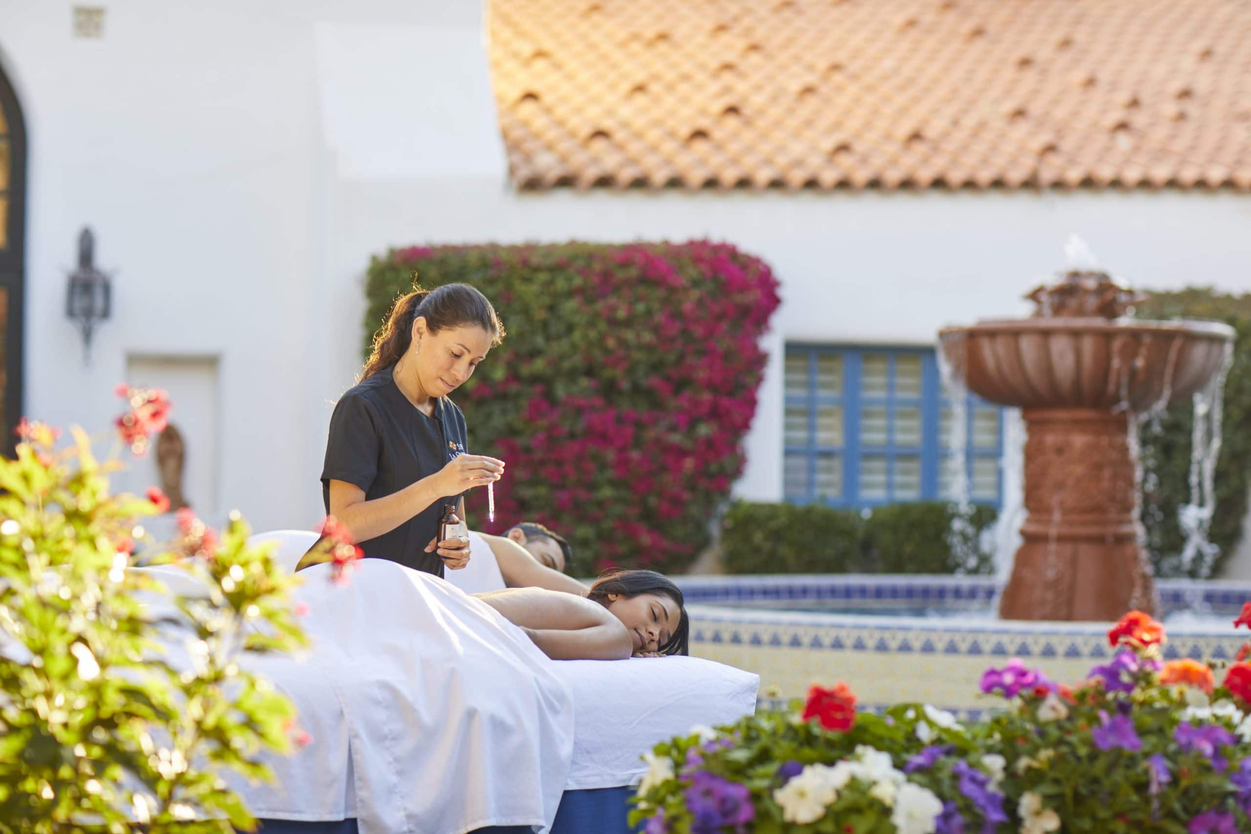Spa La Quinta: Tranquil massage session outdoors with lush garden views.