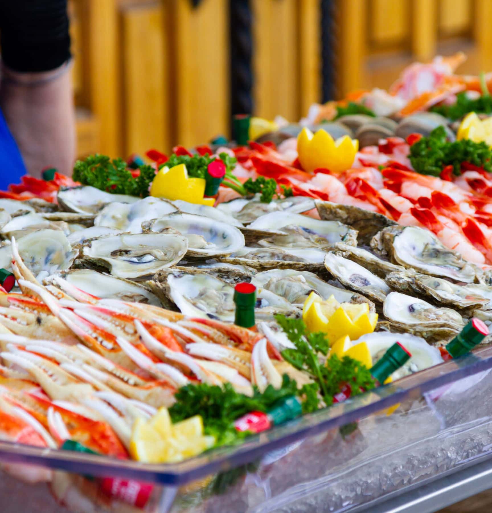 Seafood platter featuring oysters, crab legs, and lemon garnishes at La Quinta Resort & Club wedding.