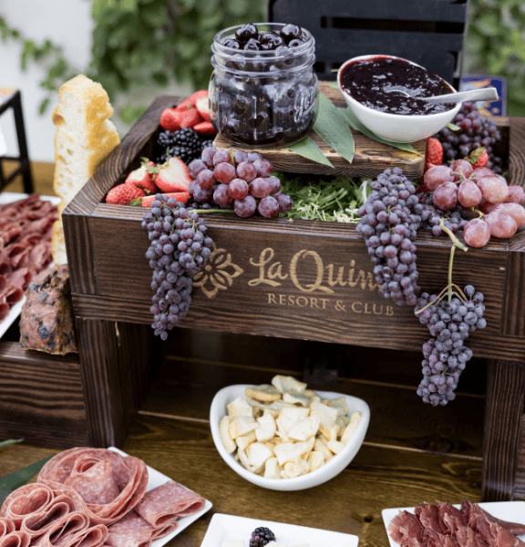 Outdoor wedding venue with fresh berries and gourmet snacks at La Quinta Resort & Club.