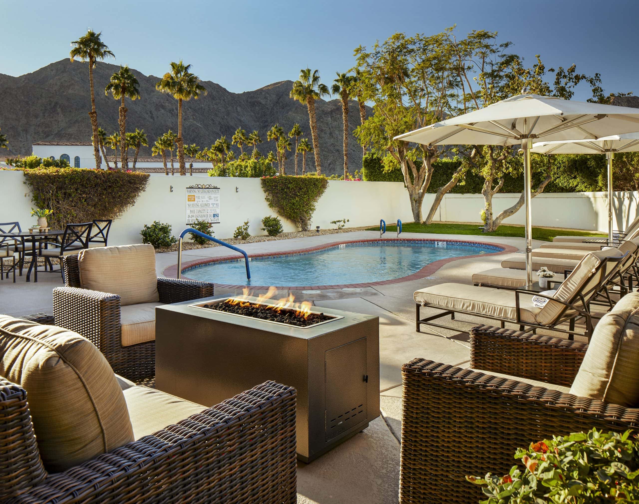 Luxurious pool area at La Quinta Resort & Club with seating and mountain views.