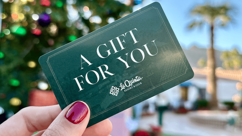 An illuminated Christmas tree at La Quinta Resort & Club during sunset.