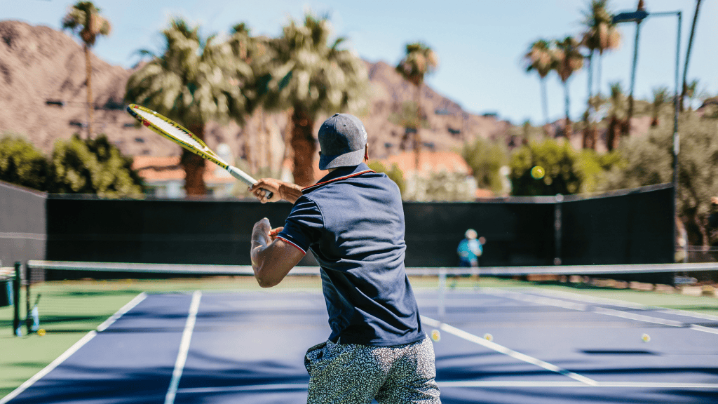 Tennis player at La Quinta Resort & Club with scenic desert backdrop.