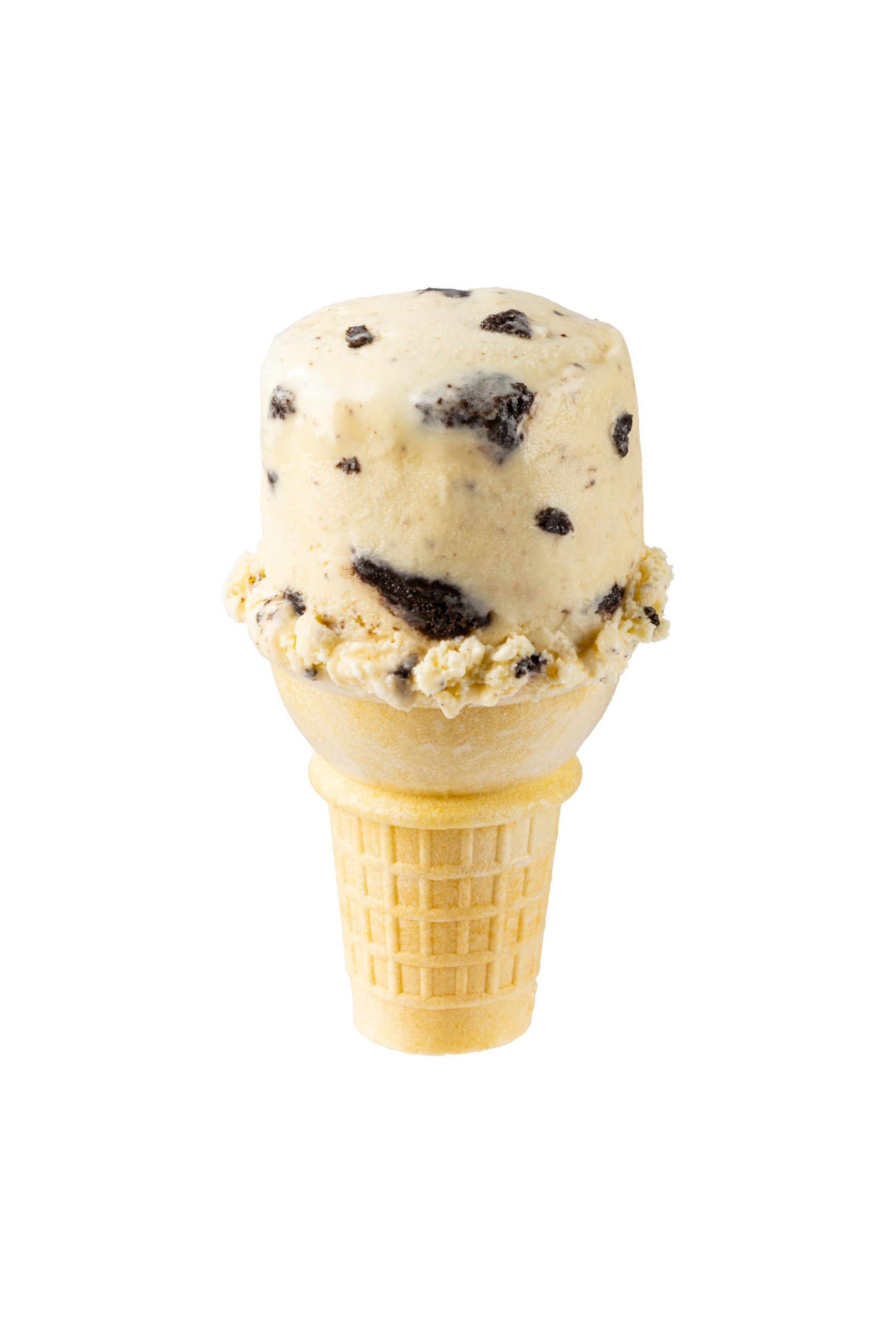 Cookies and cream ice cream cone with chocolate cookie chunks in a waffle cone.