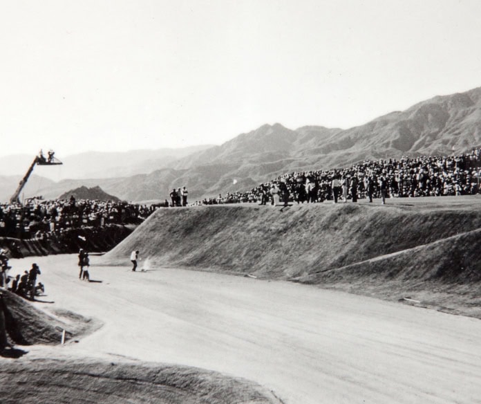 Historic golf tournament at La Quinta Resort & Club with spectators and scenic mountain views.