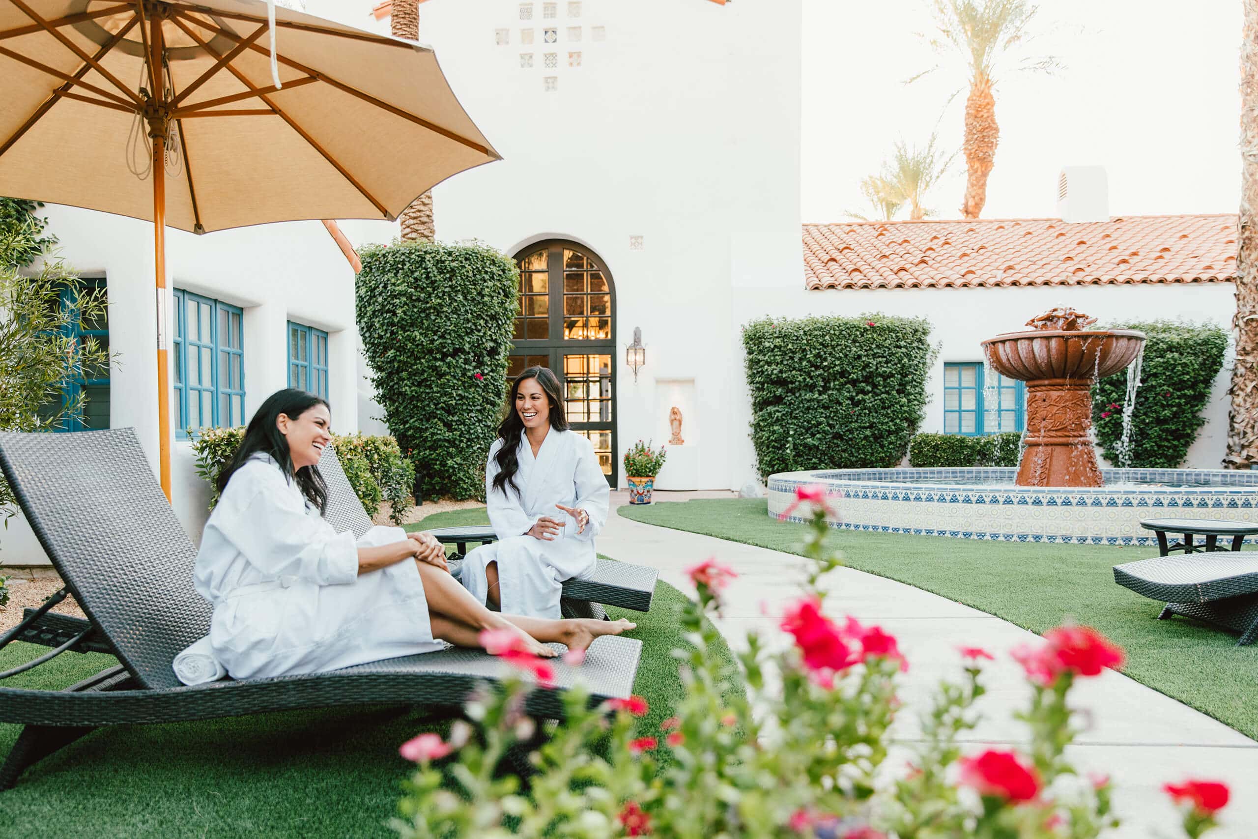 Relaxing spa treatment with two women enjoying the outdoor lounge at La Quinta Resort & Club.