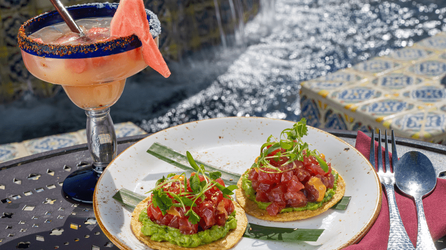 Poolside dining with cocktails and fresh tuna tostadas at La Quinta Resort.
