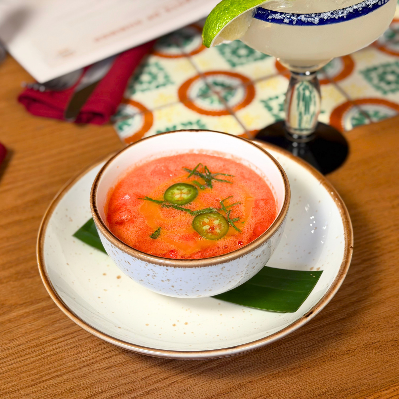 Tomato soup garnished with jalapeño slices served at La Quinta Resort.