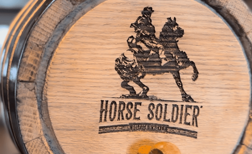 Close-up of Horse Soldier Bourbon label on glass bottle.
