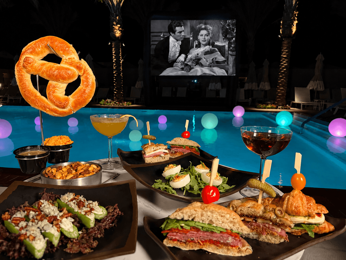 Poolside dining with snacks, drinks, and a movie at La Quinta Resort & Club.