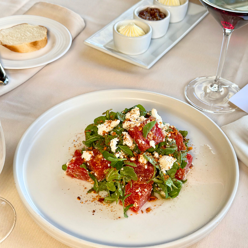 Fresh gourmet salad with arugula, cheese, and dressing at La Quinta Resort.