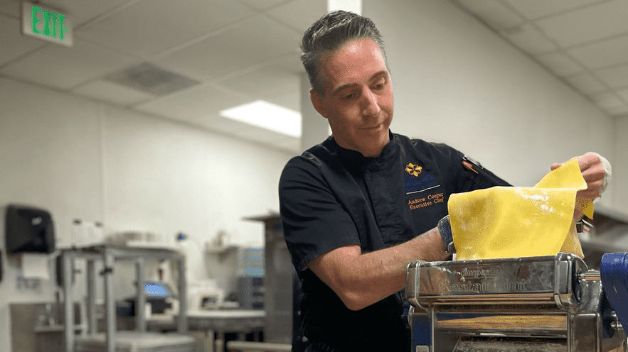Chef preparing a gourmet dish in a professional kitchen at La Quinta Resort.