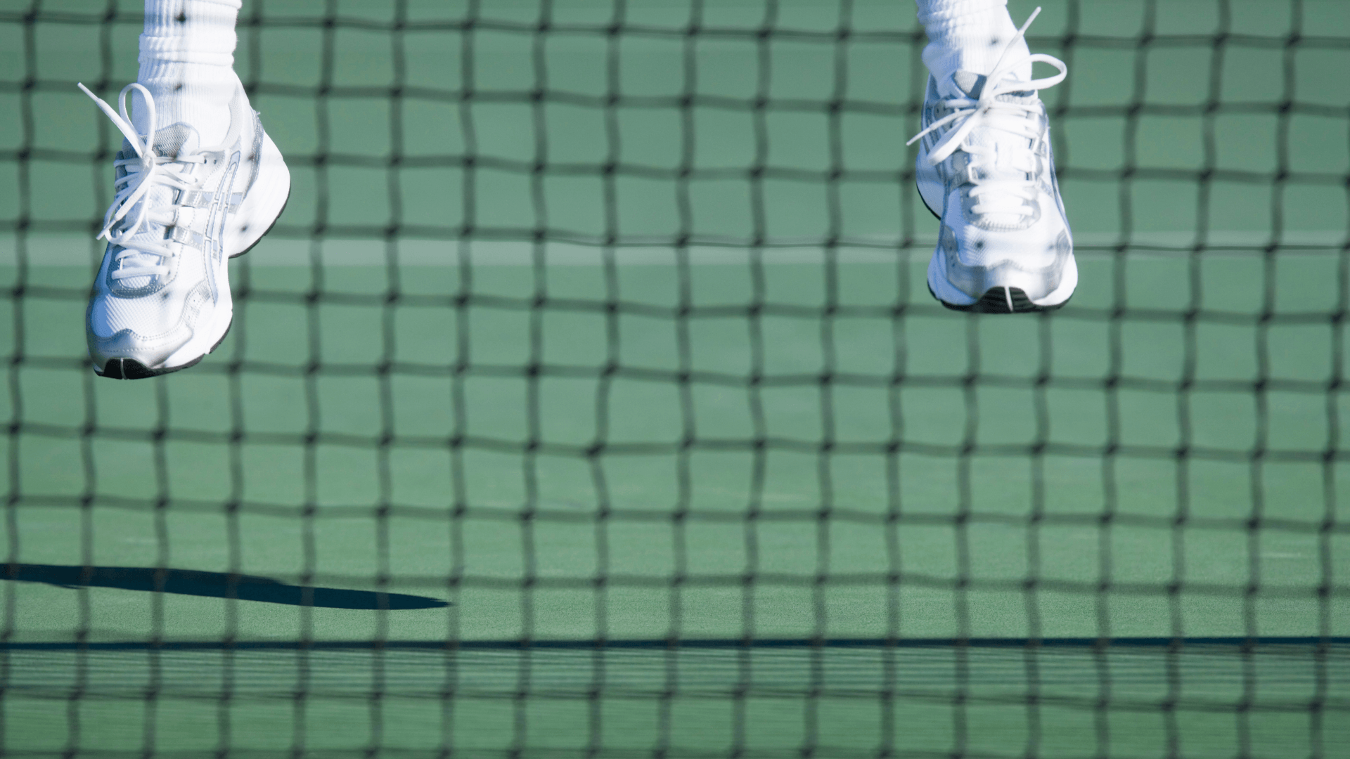 Tennis court at La Quinta Resort & Club with player in action.