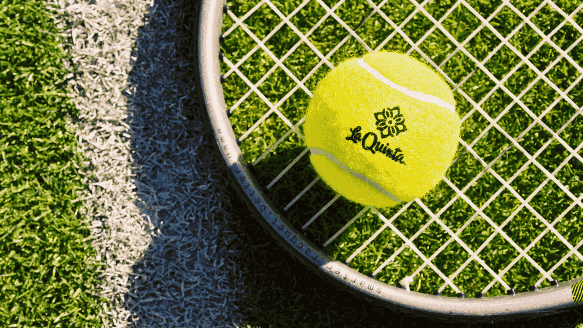 Tennis ball with La Quinta logo on tennis racket at La Quinta Resort.