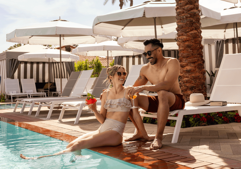 Relaxing couple enjoying poolside at La Quinta Resort & Club during Christmas season.