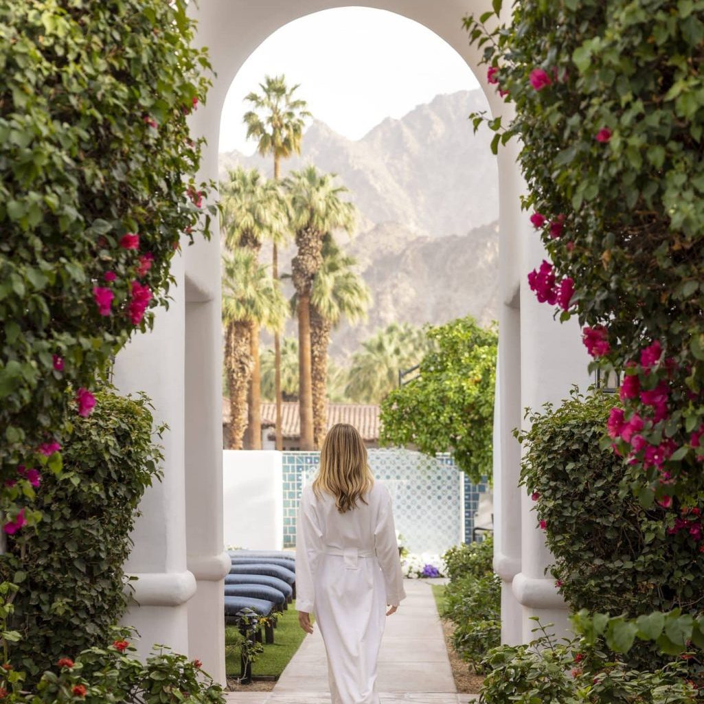Scenic view of La Quinta Resort with palm trees and mountains in the background.