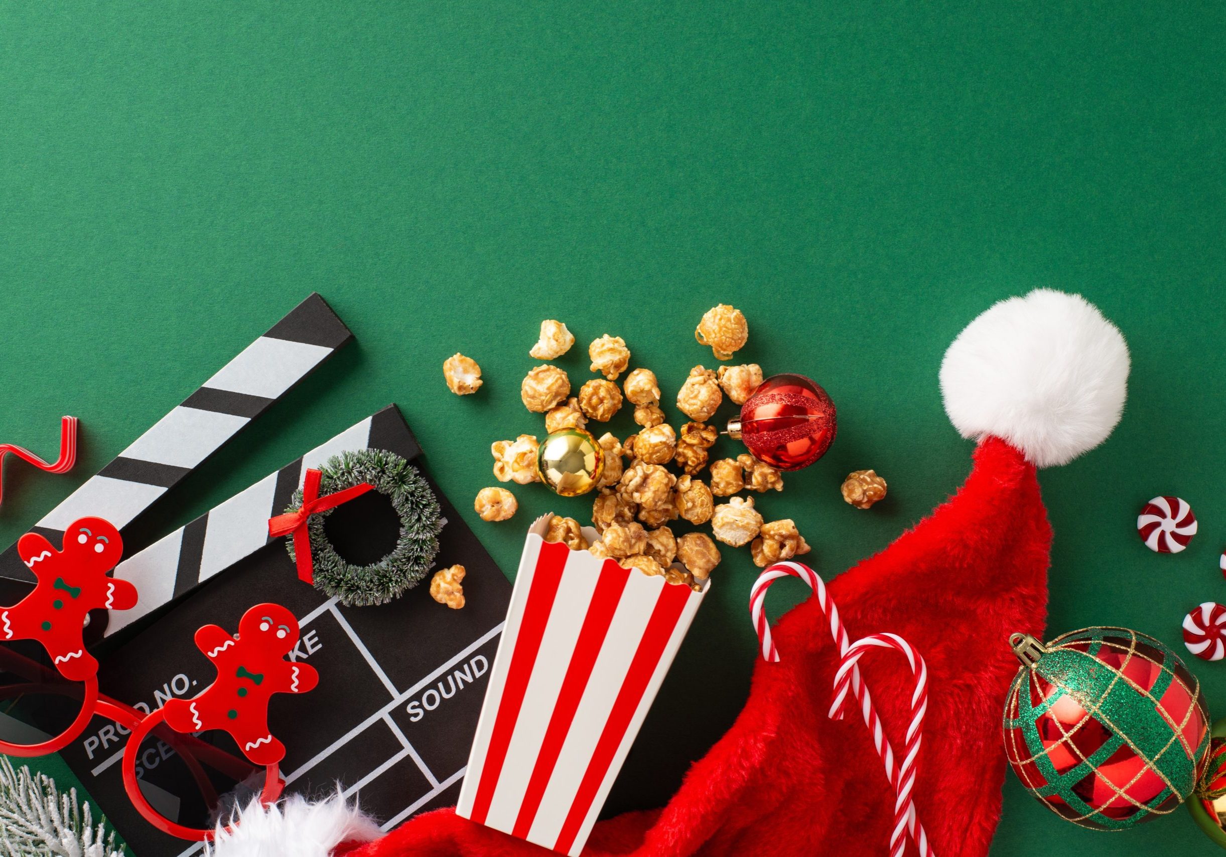 Festive holiday scene with popcorn, Santa hat, and ornaments.
