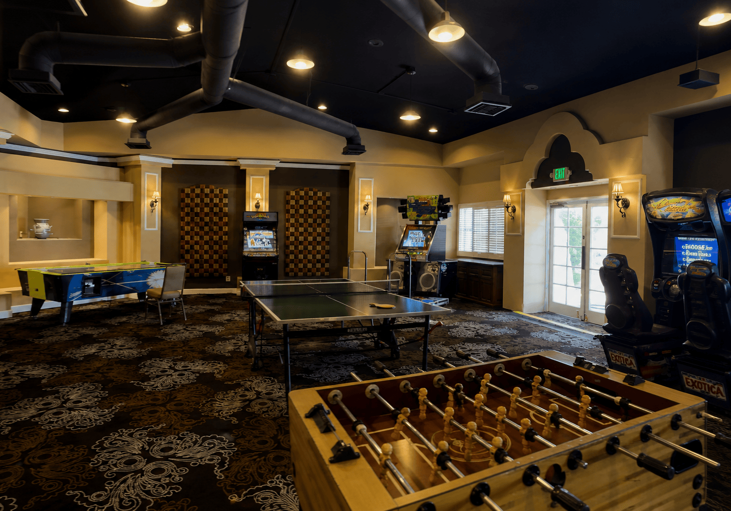 Indoor game room with ping pong, foosball, and arcade games at La Quinta Resort & Club.
