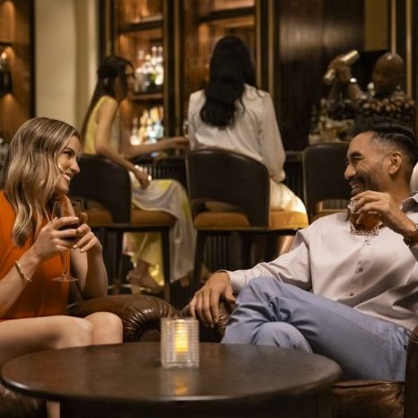 Elegant resort lounge with guests enjoying drinks and conversation.