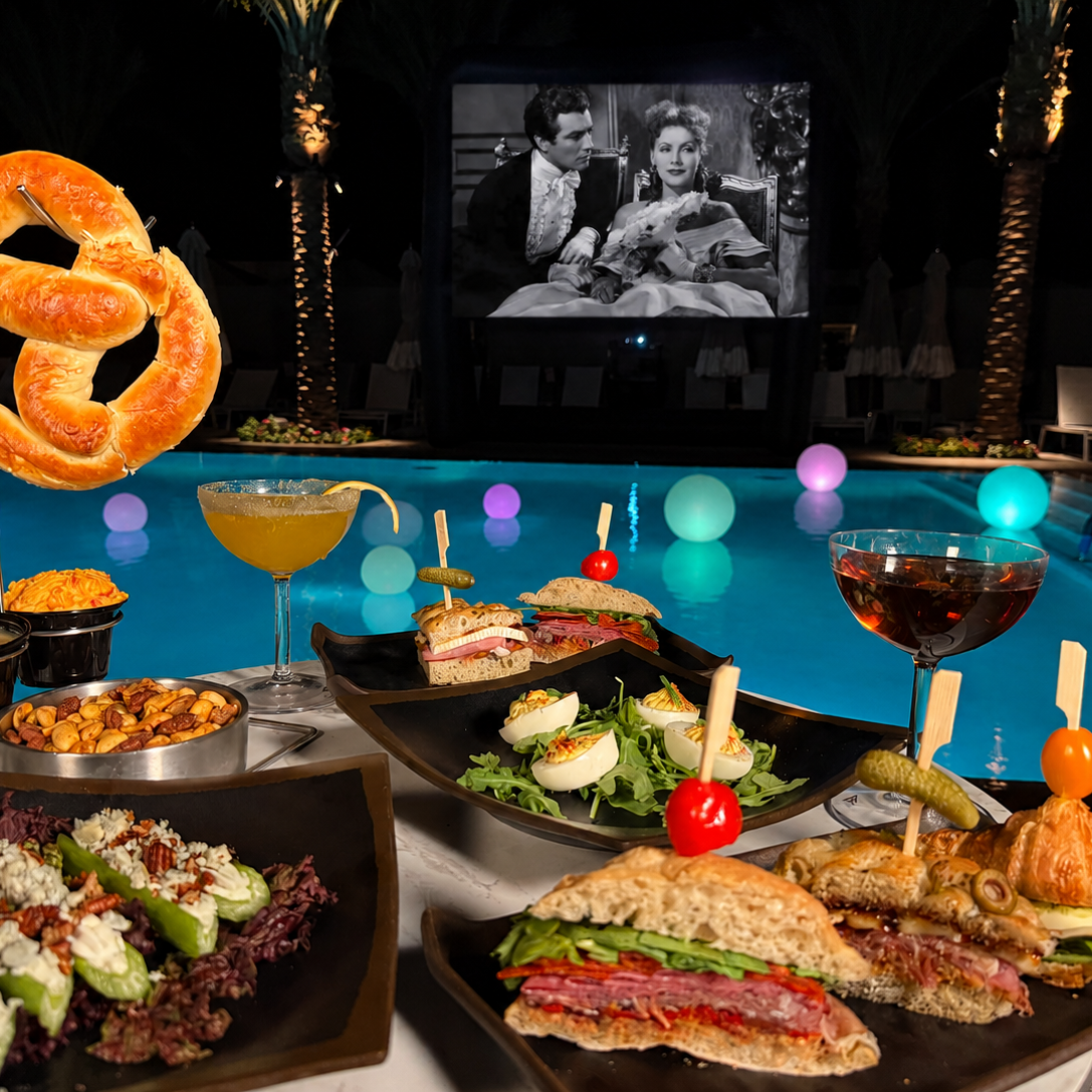 Poolside dining with snacks, drinks, and a movie at La Quinta Resort.