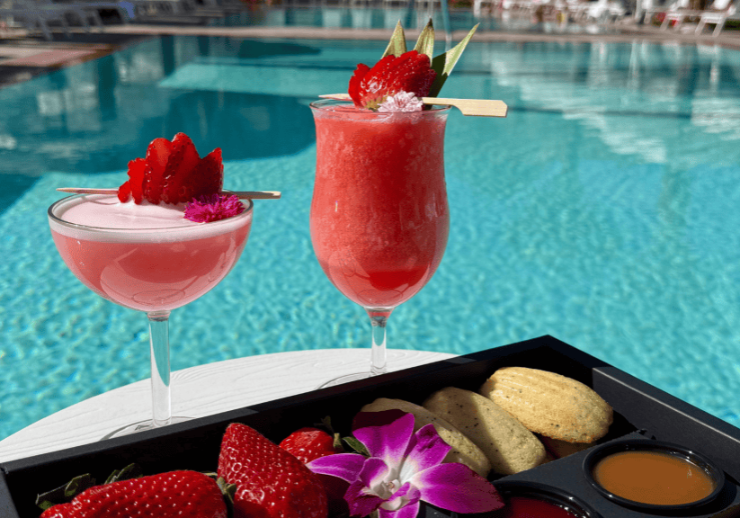 Elegant cocktails with fresh strawberries by the poolside. Perfect for relaxing at La Quinta Resort.