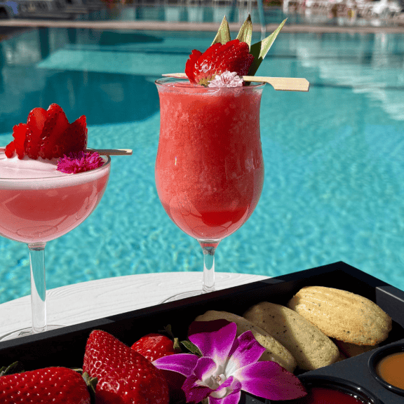 Elegant cocktails with fresh strawberries by the poolside. Perfect for relaxing at La Quinta Resort.