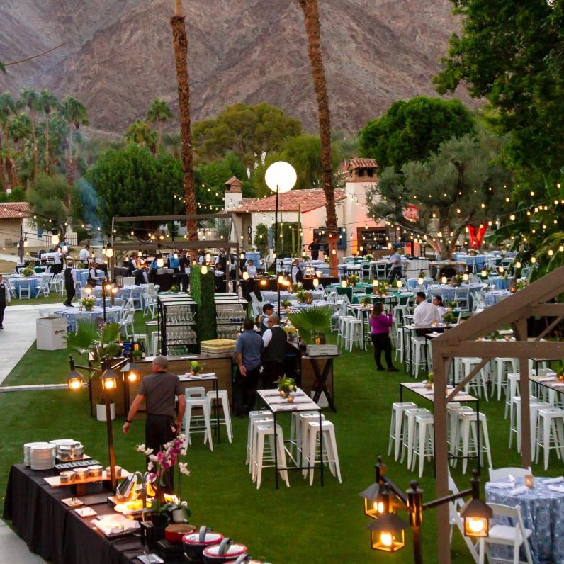 Elegant outdoor meeting setup at La Quinta Resort & Club with lush greenery and mountain views.