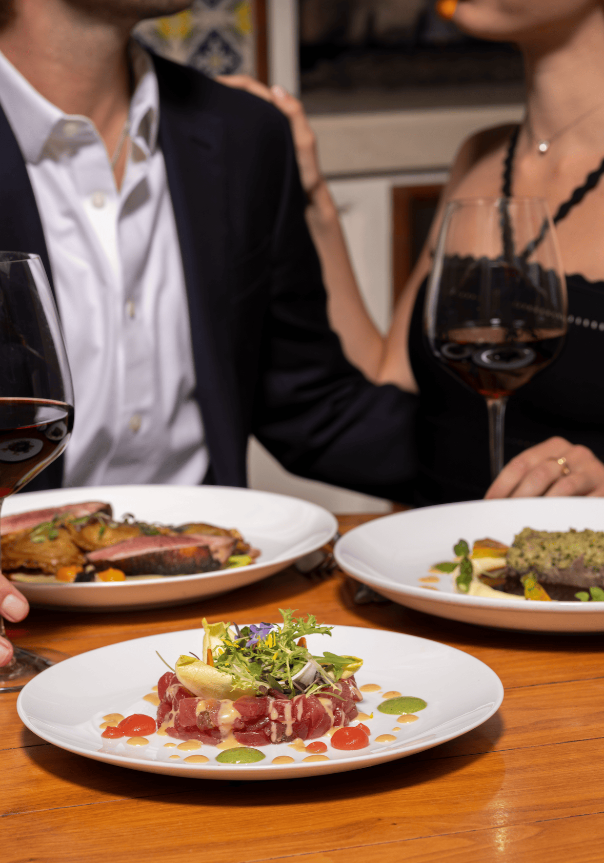 Elegant dining with gourmet dishes and fine wine for Mother’s Day celebration.