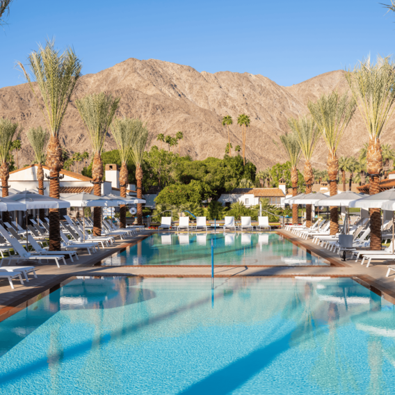 Luxury pool at La Quinta Resort & Club with mountain views and palm trees.